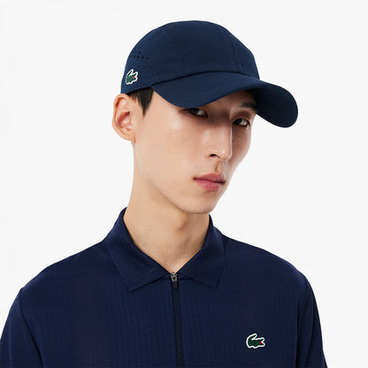 Cap Lacoste On Court